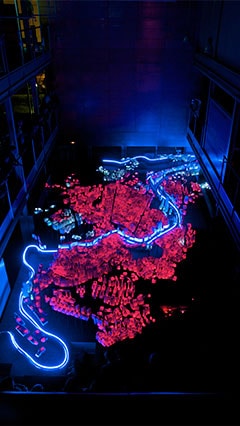 display the urban evolution of a city with light